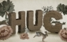 Furry type created using layered coloured paper 135 gsm. Letter height 7.5cm.