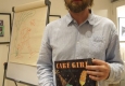 David Lucas holding one of his books
