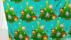 Throw blanket with a Christmassy pattern and characters